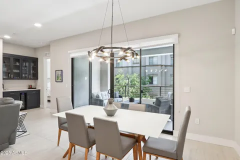 a large kitchen with a table and chairs
