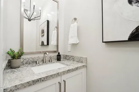 a view of a dining room with furniture wooden floor and chandelier