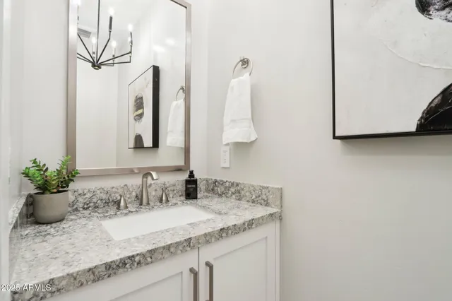 a view of a dining room with furniture wooden floor and chandelier