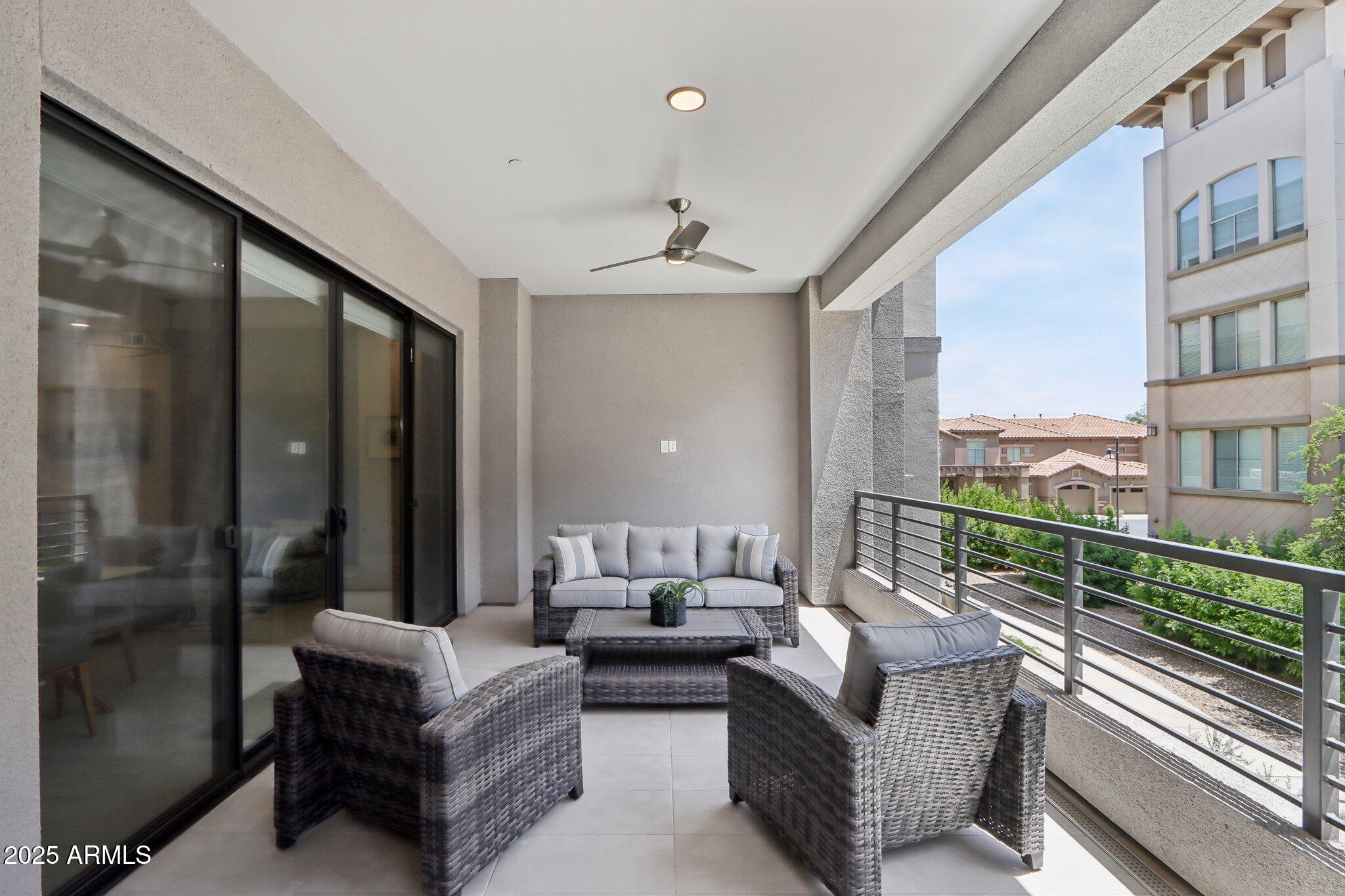5250 East Deer Valley Drive, Unit 247 Phoenix, AZ 85054 - Photo 27 of 56 a living room with furniture and a window