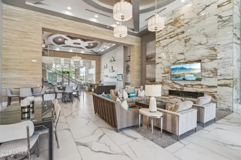 a living room with lots of furniture and a table