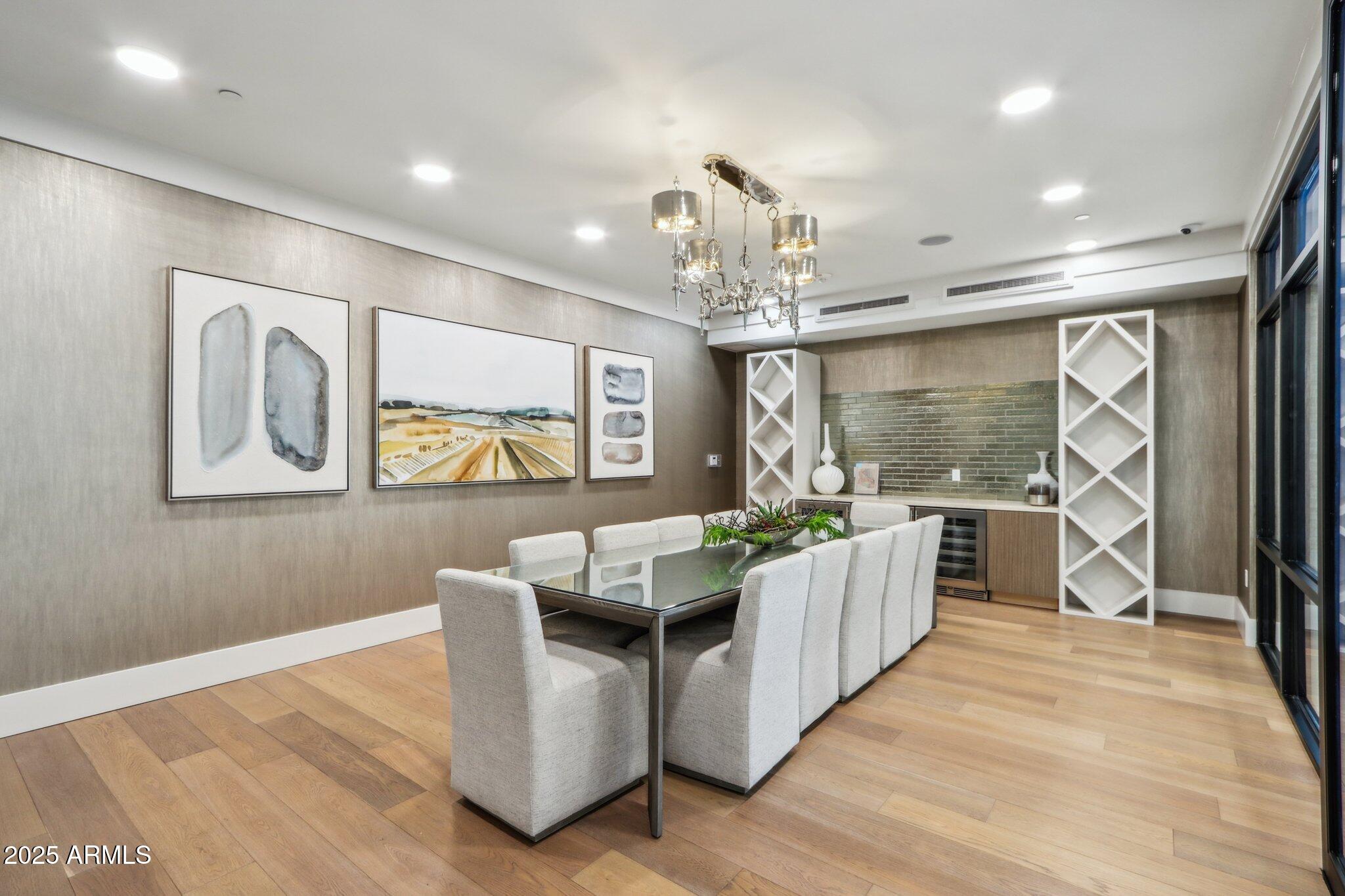 5250 East Deer Valley Drive, Unit 247 Phoenix, AZ 85054 - Photo 35 of 56 a living room with furniture a large window and wooden floor