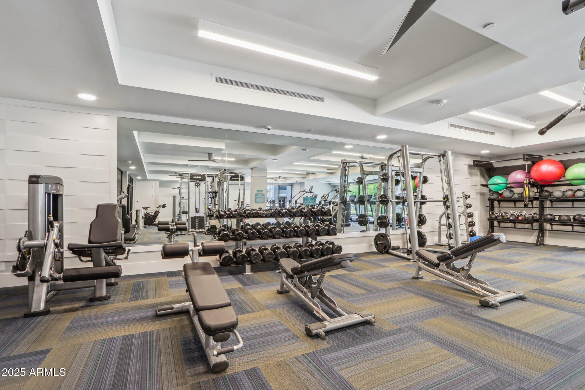 5250 East Deer Valley Drive, Unit 247 Phoenix, AZ 85054 - Photo 37 of 56 a view of a room with gym equipment