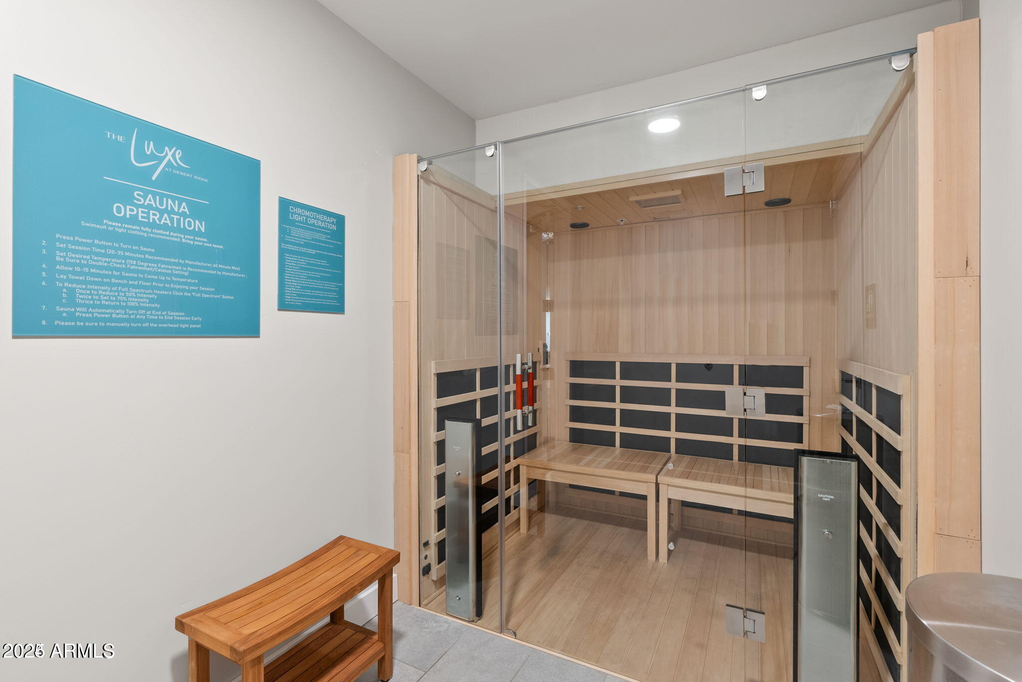 5250 East Deer Valley Drive, Unit 247 Phoenix, AZ 85054 - Photo 40 of 56 a view of a room with wooden floor and bench