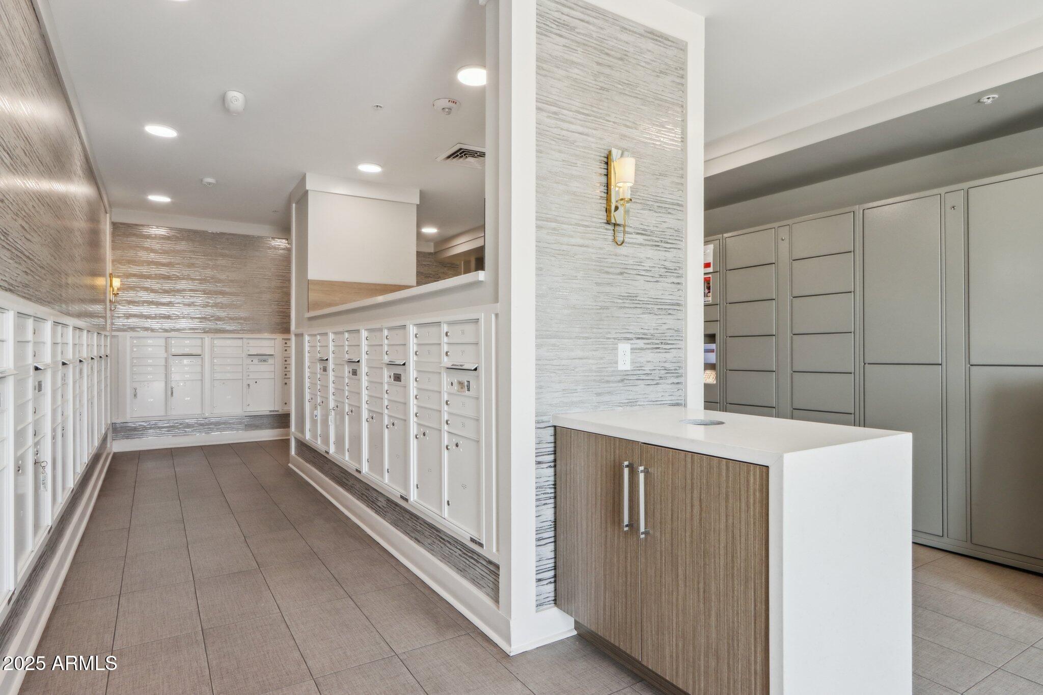 5250 East Deer Valley Drive, Unit 247 Phoenix, AZ 85054 - Photo 41 of 56 a view of a bathroom with a sink a mirror and shower
