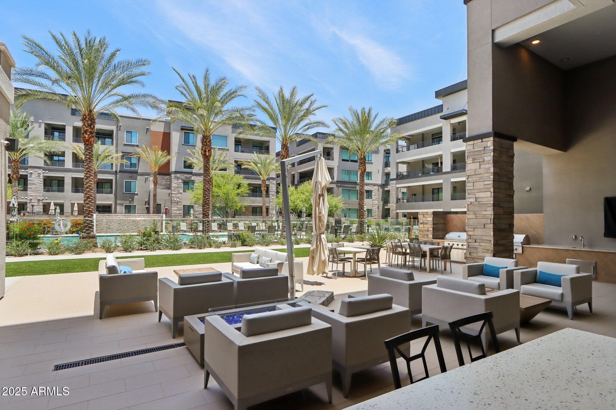 5250 East Deer Valley Drive, Unit 247 Phoenix, AZ 85054 - Photo 42 of 56 a outdoor space with lots of tables and chairs