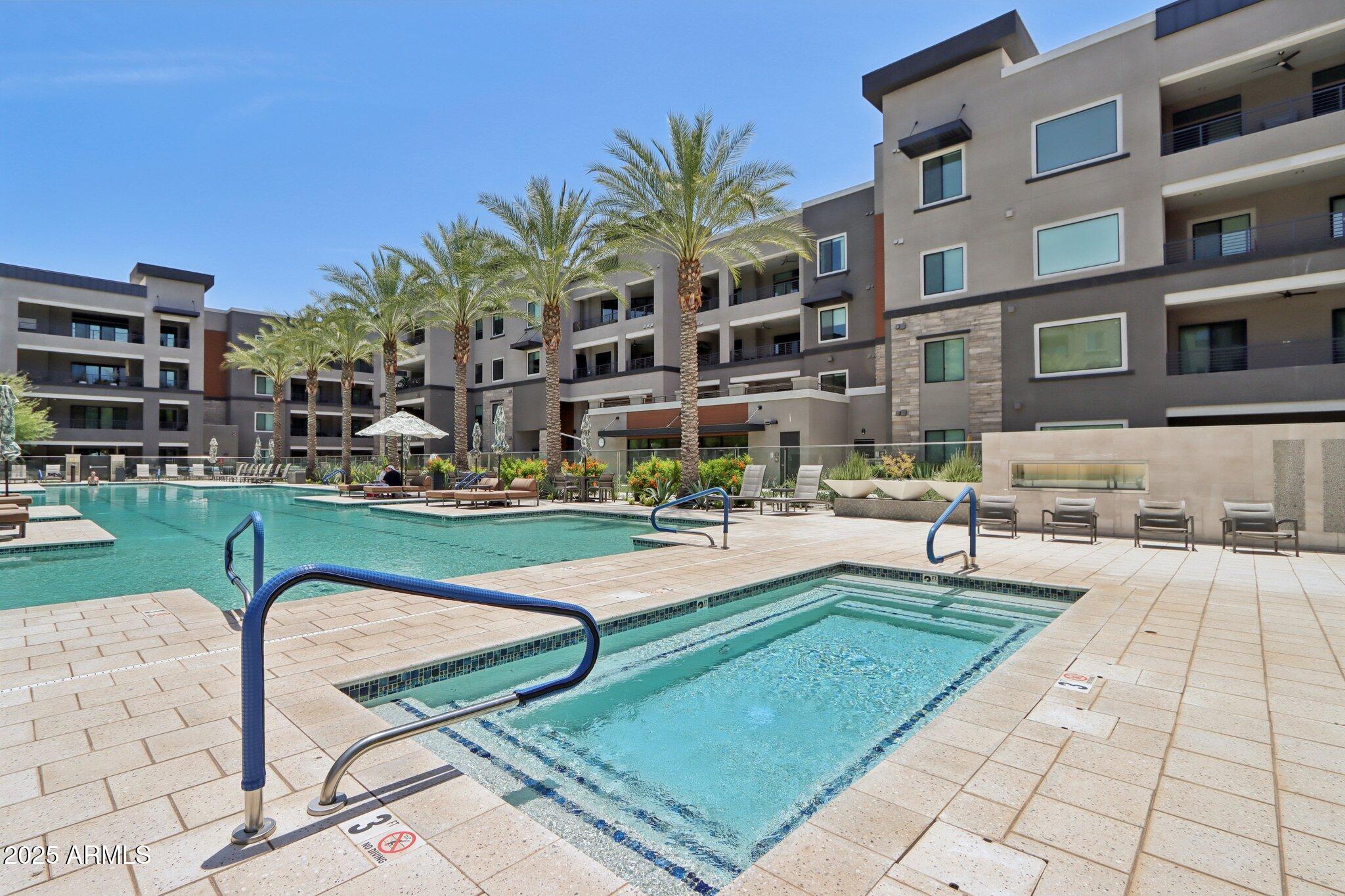 5250 East Deer Valley Drive, Unit 247 Phoenix, AZ 85054 - Photo 48 of 56 a view of a building with garden and sitting area