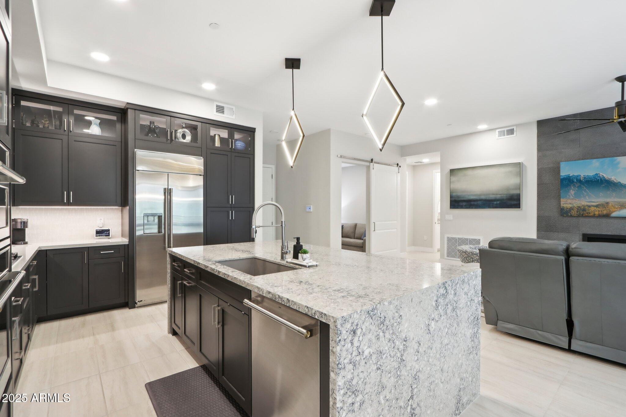 5250 East Deer Valley Drive, Unit 247 Phoenix, AZ 85054 - Photo 5 of 56 Kitchen with upgraded lighting