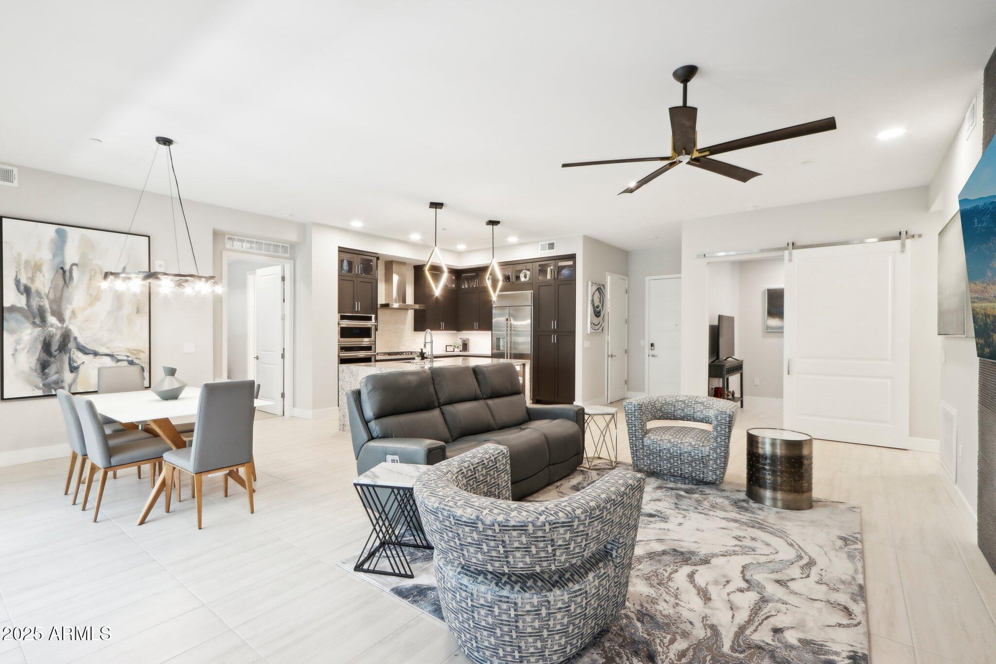 5250 East Deer Valley Drive, Unit 247 Phoenix, AZ 85054 - Photo 55 of 56 a living room with furniture and kitchen view