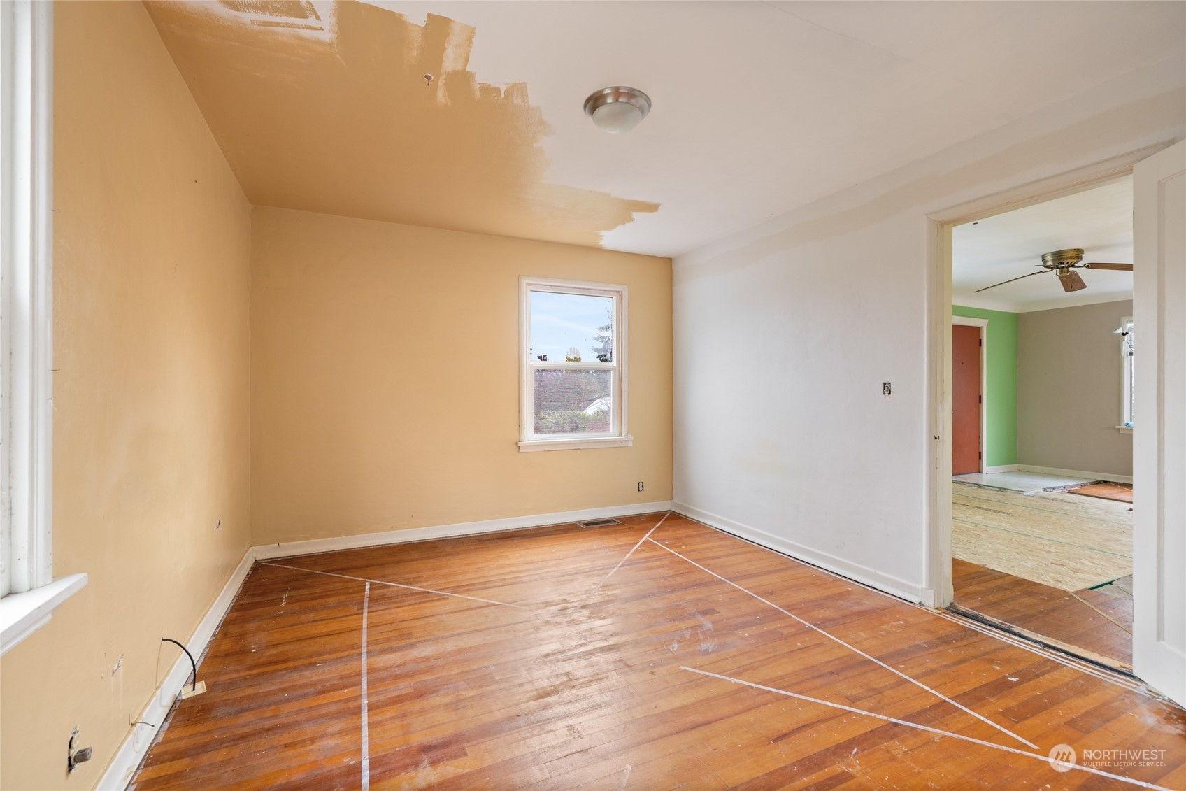 1136 Naval Avenue Bremerton, WA 98312 - Photo 25 of 34 a view of an empty room with wooden floor and a window