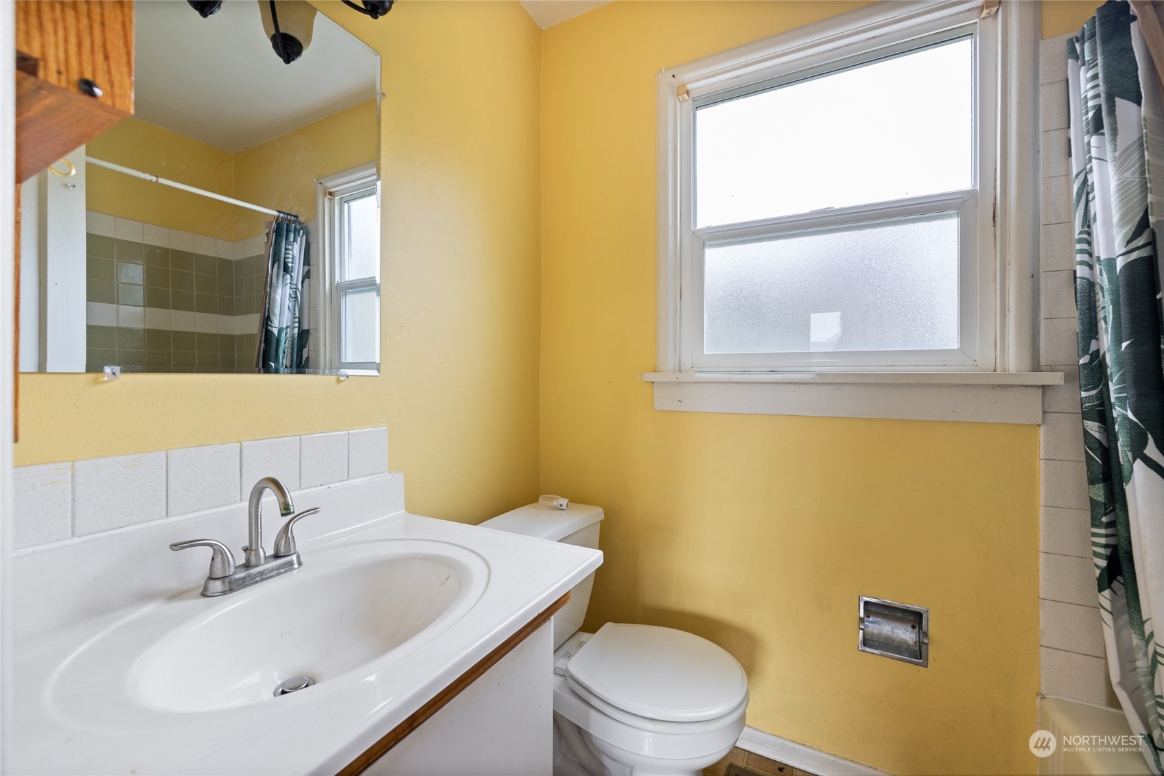 1136 Naval Avenue Bremerton, WA 98312 - Photo 26 of 34 a bathroom with a sink and a mirror