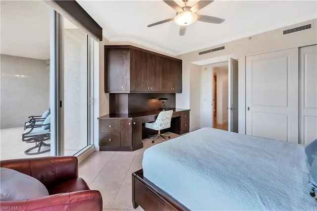 a balcony view with a couple of chairs