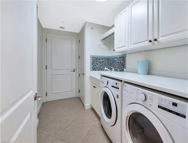 a bedroom with a large bed and a large window