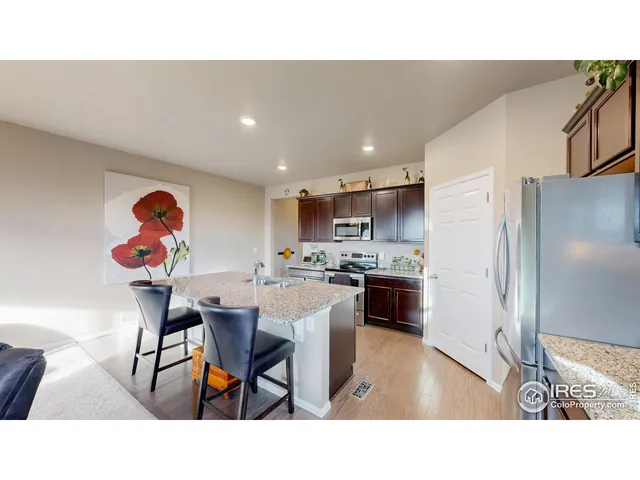 a kitchen with a table and chairs in it