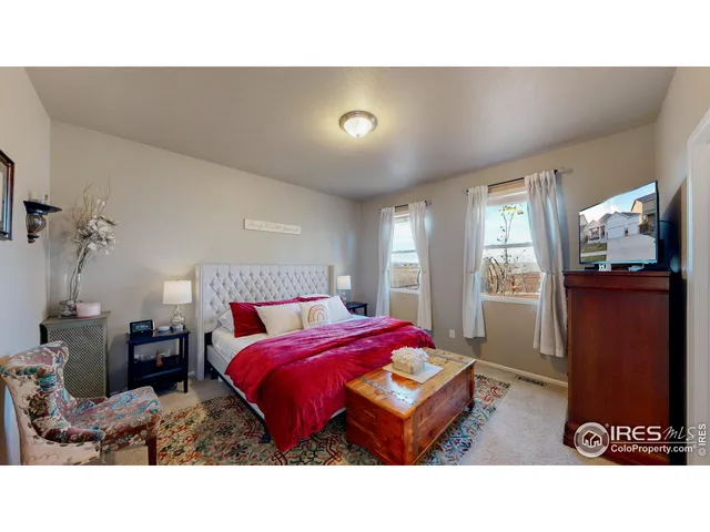 a living room with a bed and furniture