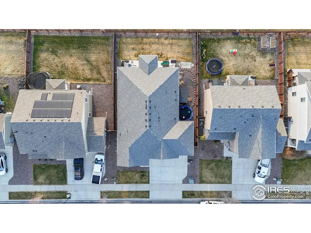 an aerial view of a house with a swimming pool