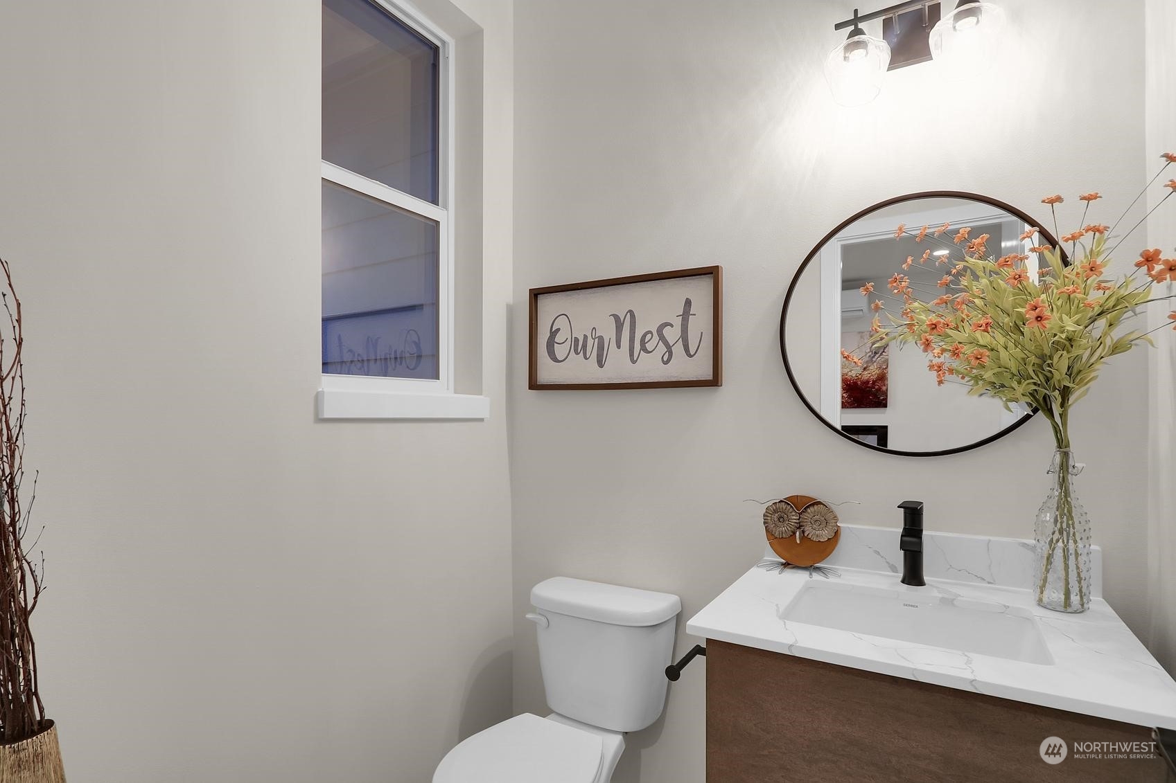 2527 Gibson Road, Unit E7 Everett, WA 98204 - Photo 11 of 21 a bathroom with a toilet sink and mirror