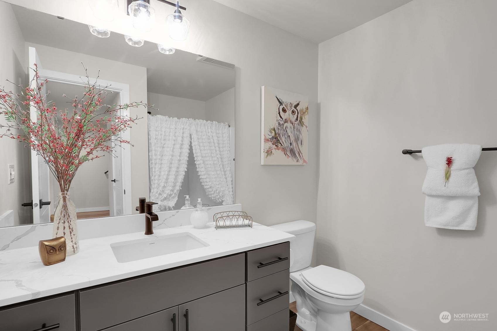 2527 Gibson Road, Unit E7 Everett, WA 98204 - Photo 19 of 21 a bathroom with a toilet sink and mirror