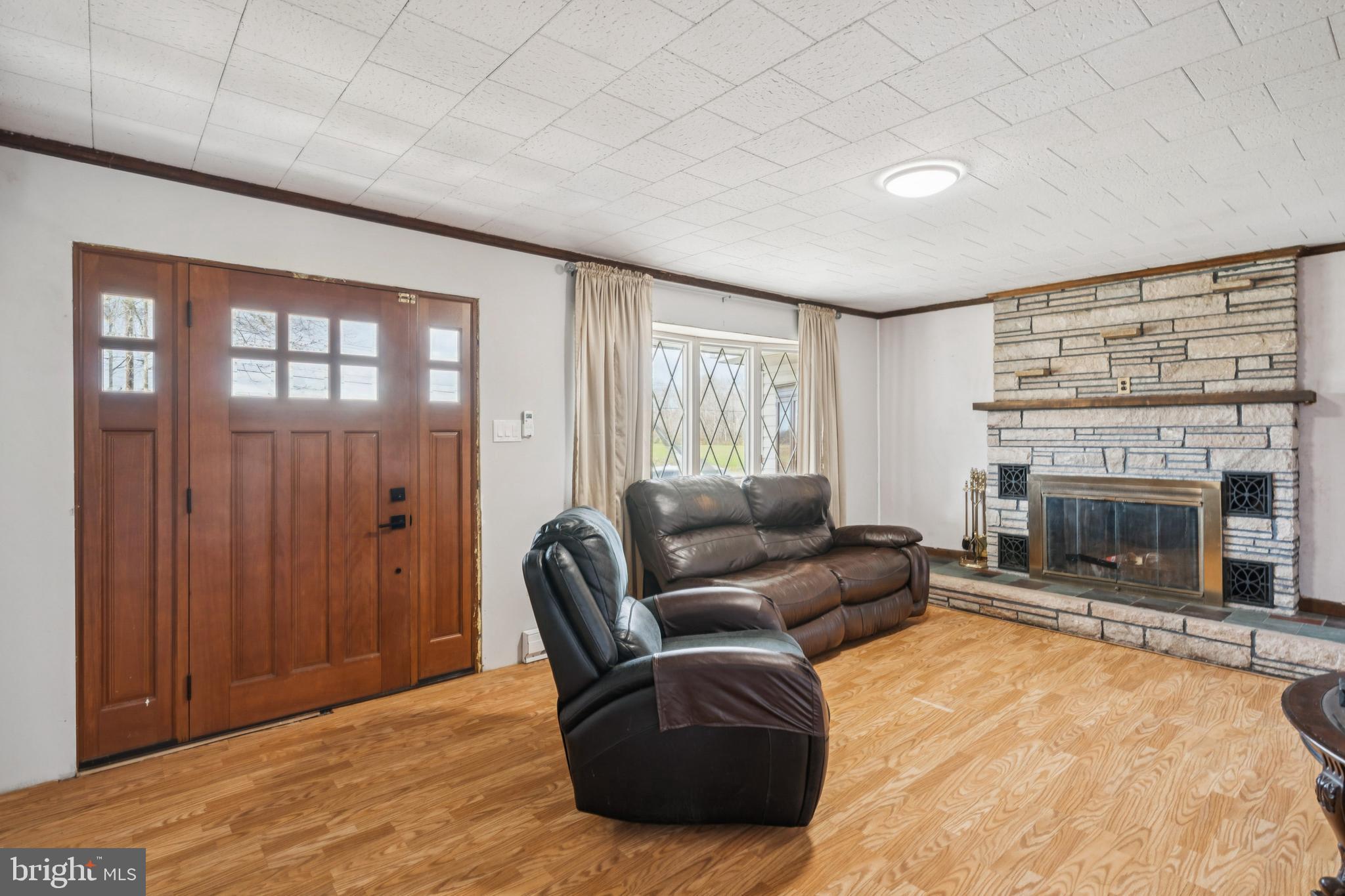 8 Inman Road New Egypt, NJ 08533 - Photo 2 of 13 a living room with furniture and a fireplace