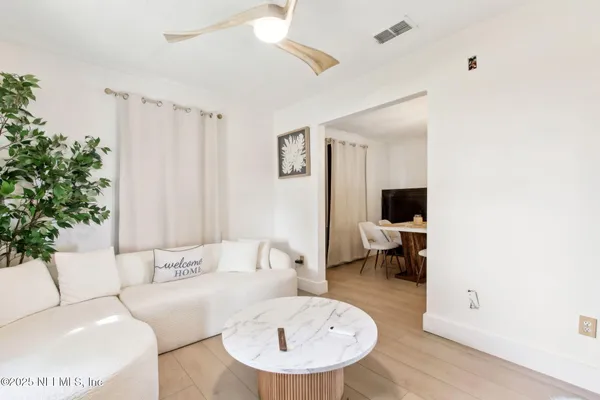 a living room with furniture and a table
