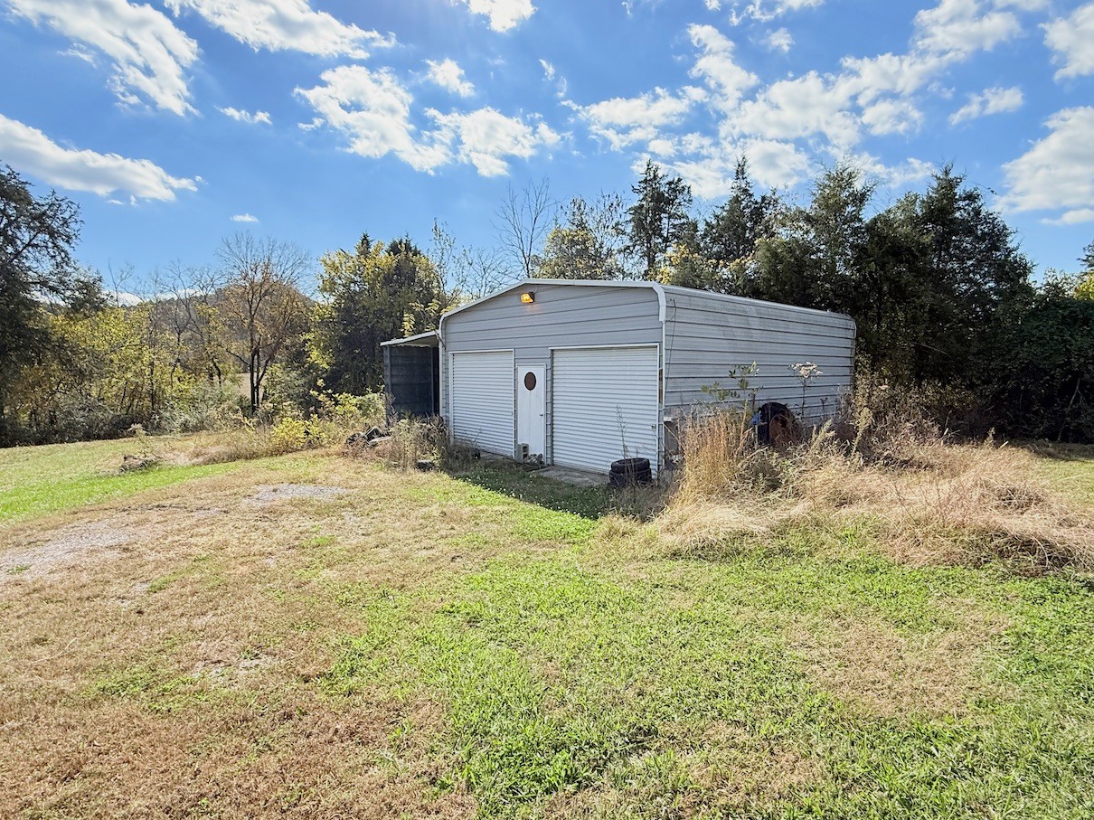 104 Vantrease Avenue Auburntown, TN 37016 - Photo 22 of 24 a view of a house with a yard