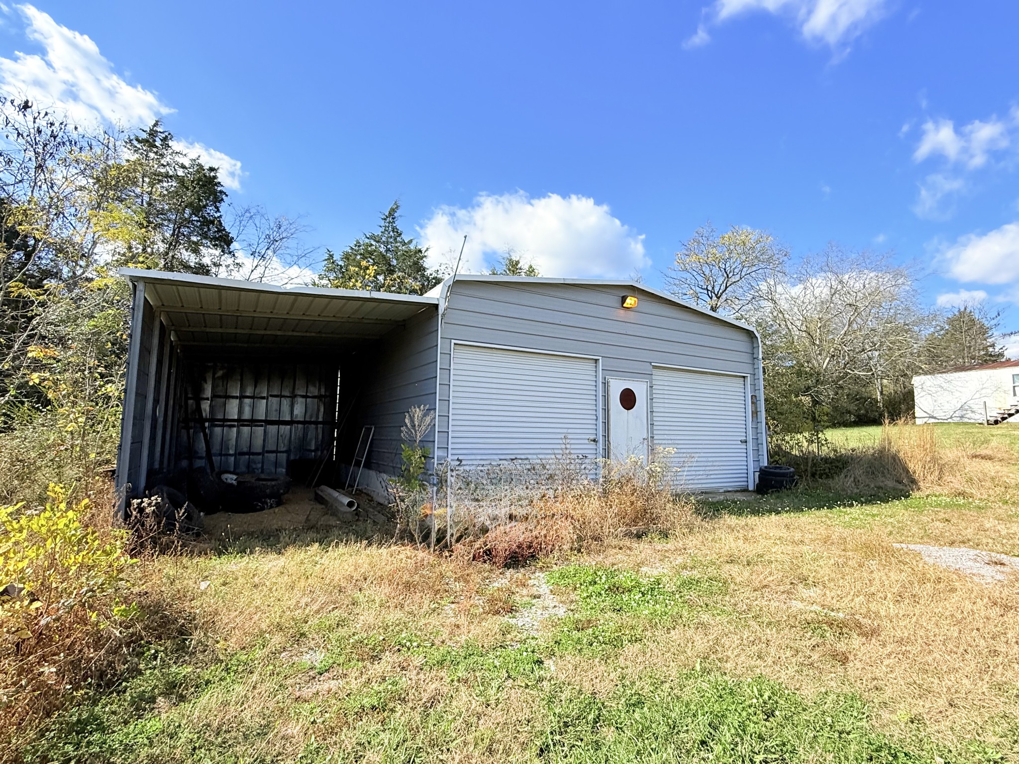104 Vantrease Avenue Auburntown, TN 37016 - Photo 23 of 24 a front view of a house with a yard