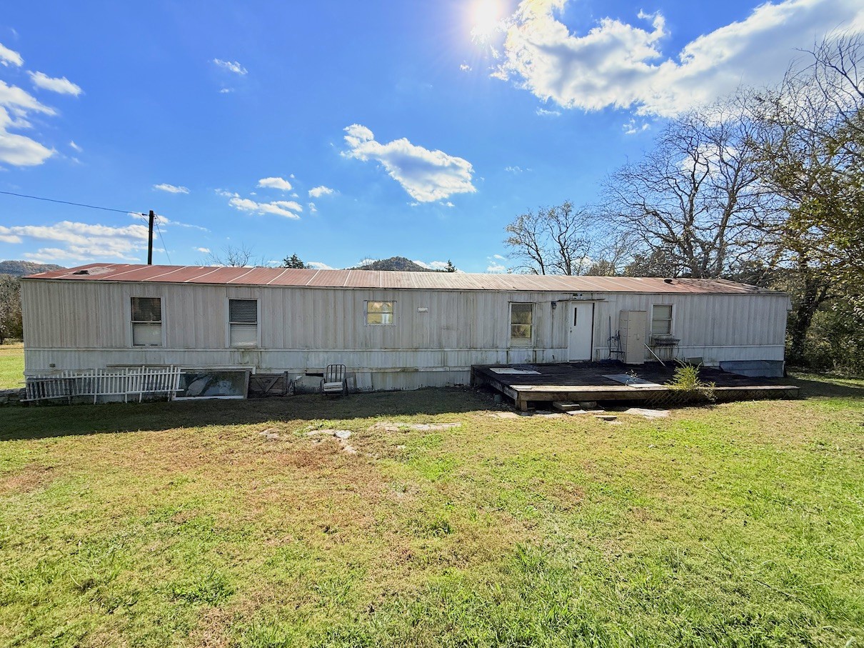 104 Vantrease Avenue Auburntown, TN 37016 - Photo 10 of 24 a view of a house with swimming pool and a yard