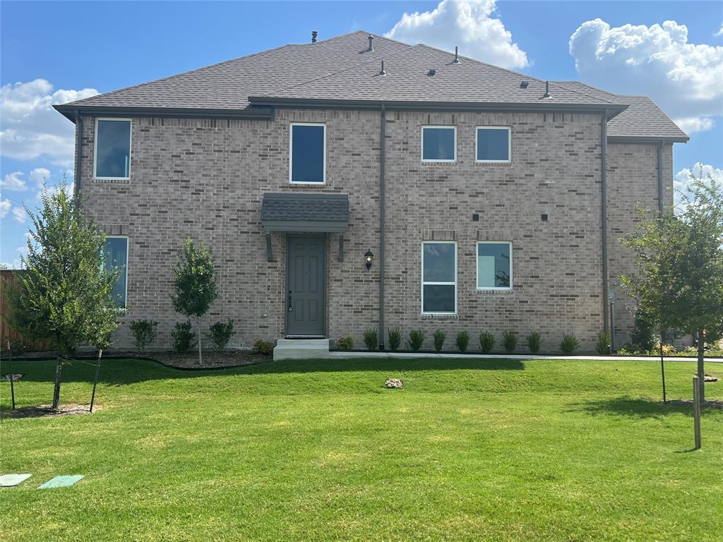 2616 Rolling Mdw Road Celina, TX 75009 - Photo 1 of 35 View of front facade with brick siding and a front yard