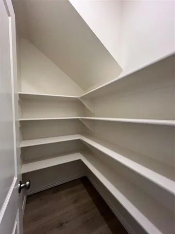 a storage room with wooden floor