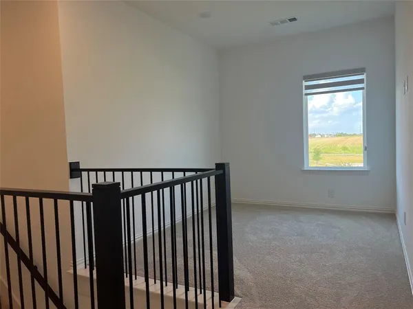 a view of staircase with window