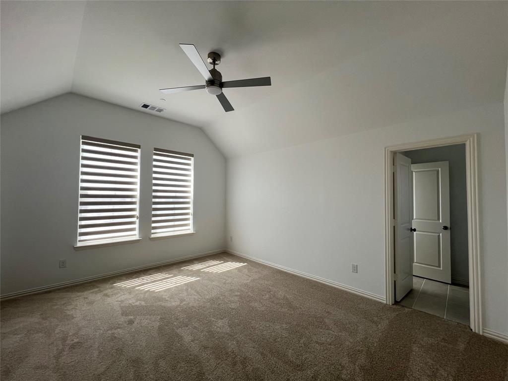 2616 Rolling Mdw Road Celina, TX 75009 - Photo 18 of 35 Additional living space featuring vaulted ceiling, carpet flooring, and a ceiling fan