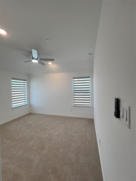 2616 Rolling Mdw Road Celina, TX 75009 - Photo 25 of 35 Spare room featuring light carpet, a ceiling fan, and recessed lighting