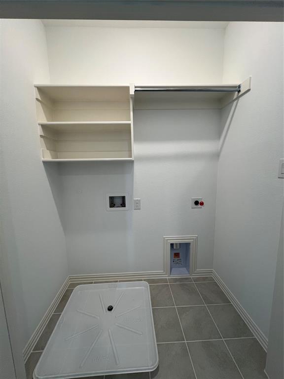 2616 Rolling Mdw Road Celina, TX 75009 - Photo 29 of 35 Laundry area with hookup for a washing machine, tile patterned floors, and hookup for an electric dryer
