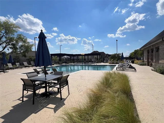 a view of a patio with chairs and tables