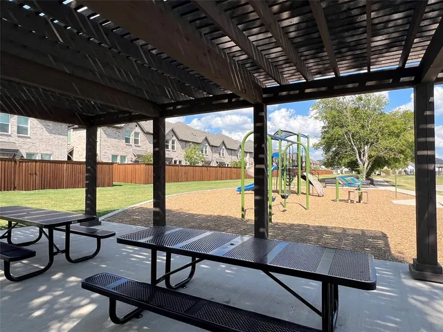 a view of a patio with a table chairs and a patio