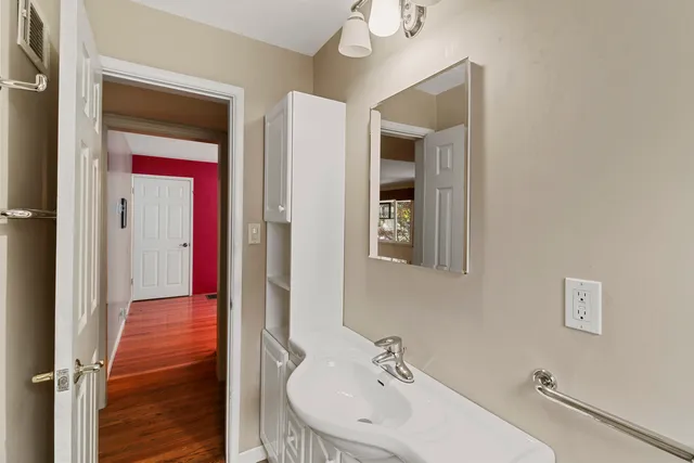 a bathroom with a sink and a mirror