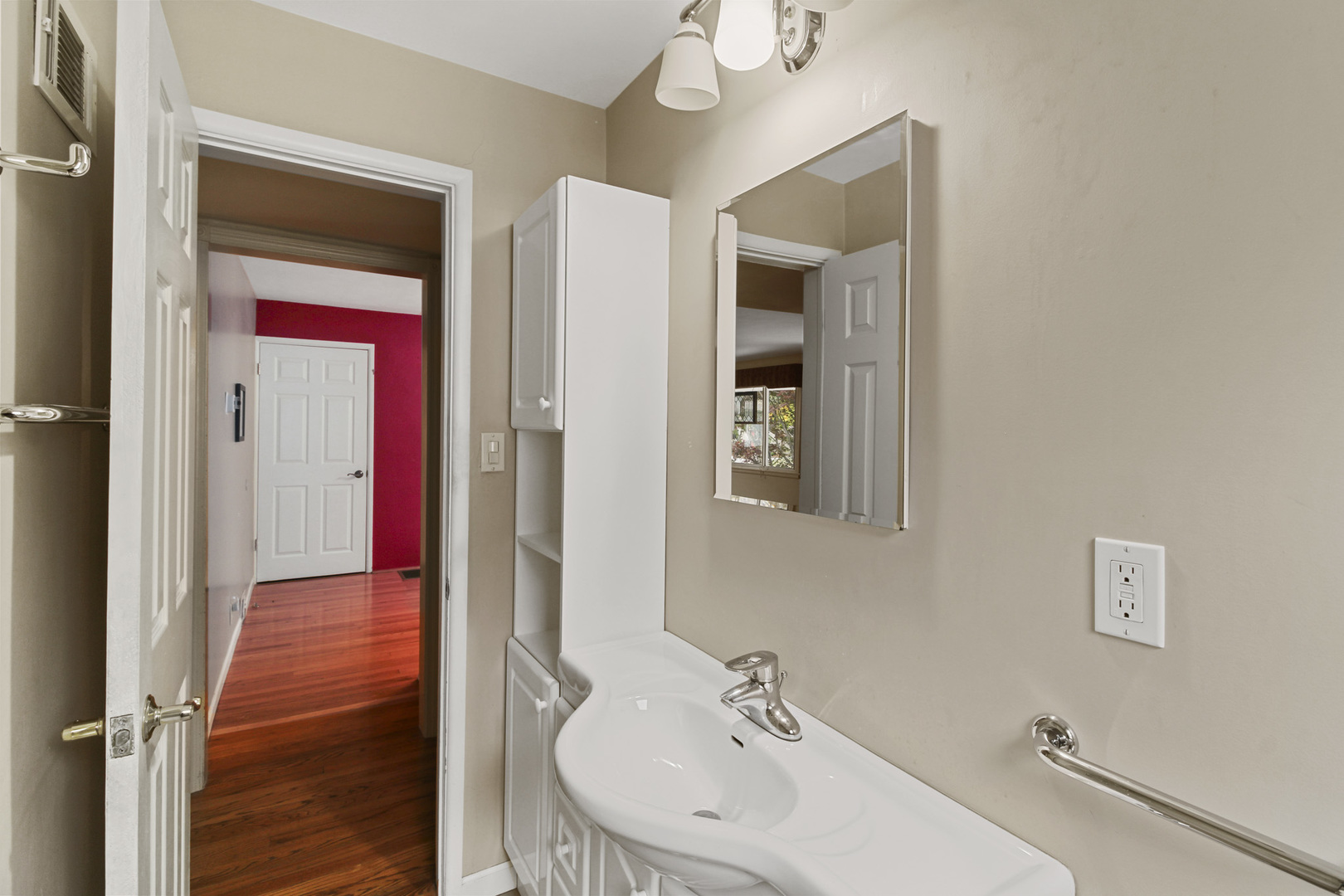 1208 West William Street Champaign, IL 61821 - Photo 15 of 30 a bathroom with a sink and a mirror