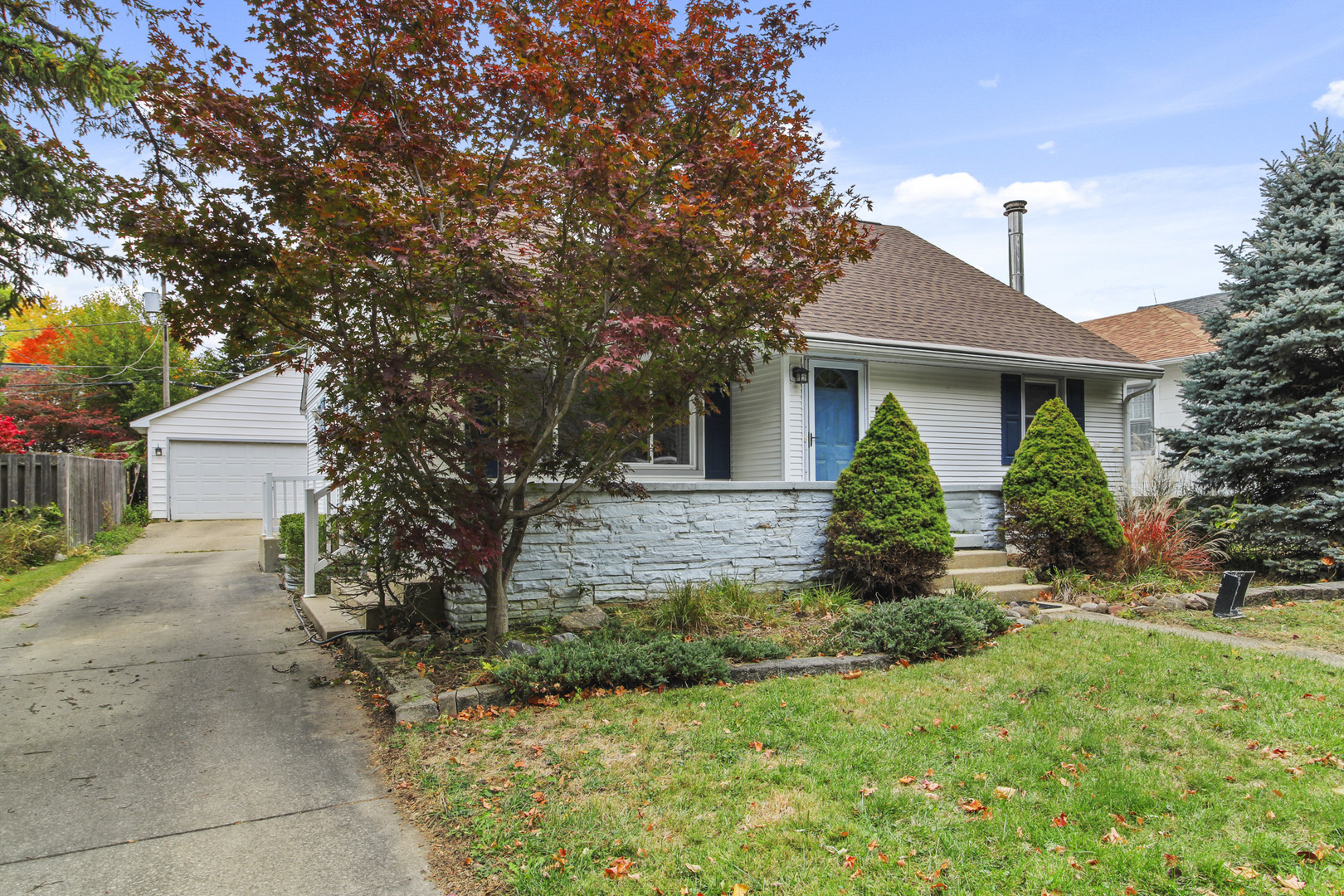 1208 West William Street Champaign, IL 61821 - Photo 2 of 30 a front view of a house with a yard and trees