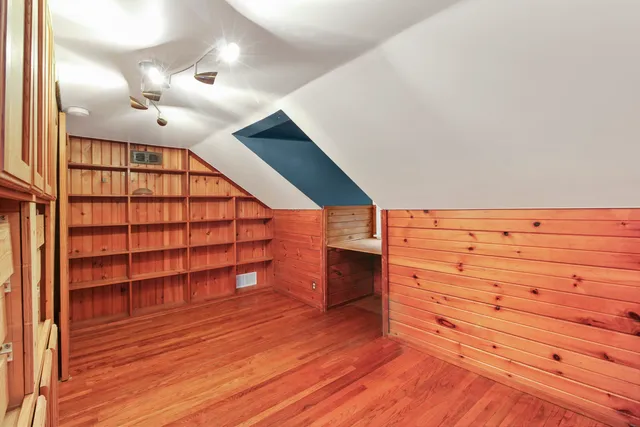 a view of front door with wooden floor