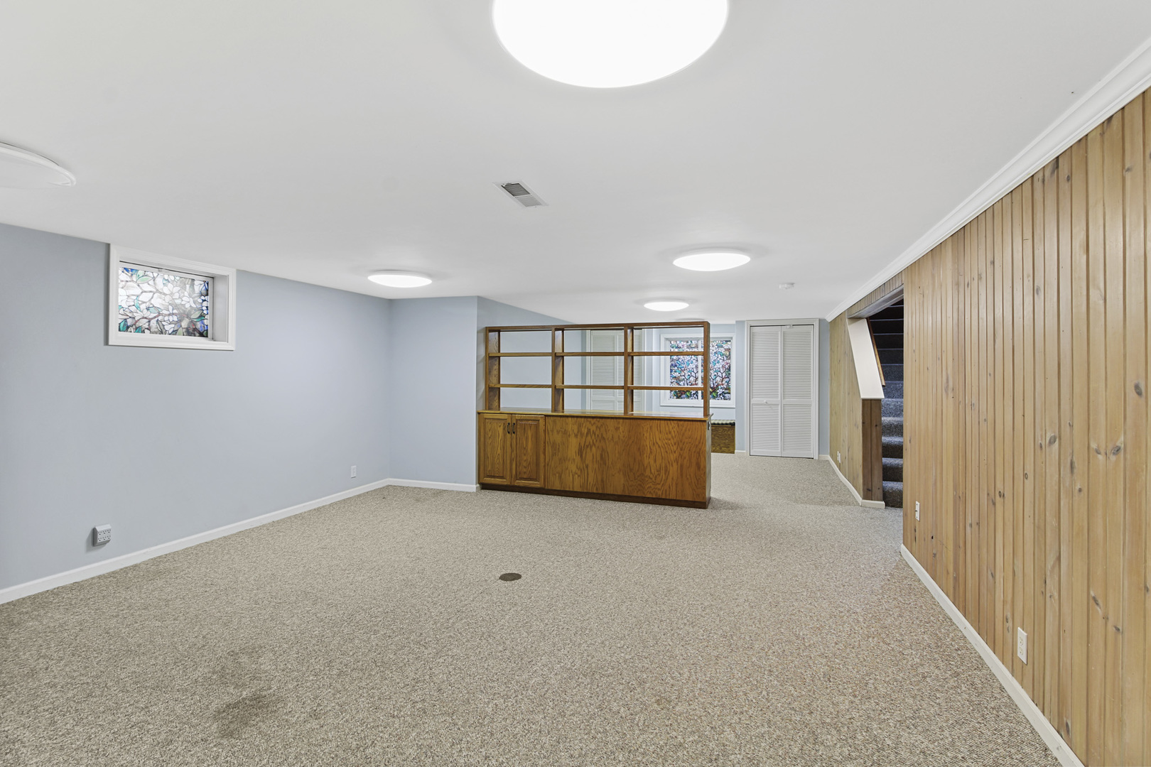 1208 West William Street Champaign, IL 61821 - Photo 24 of 30 a view of an empty room with a window and closet area