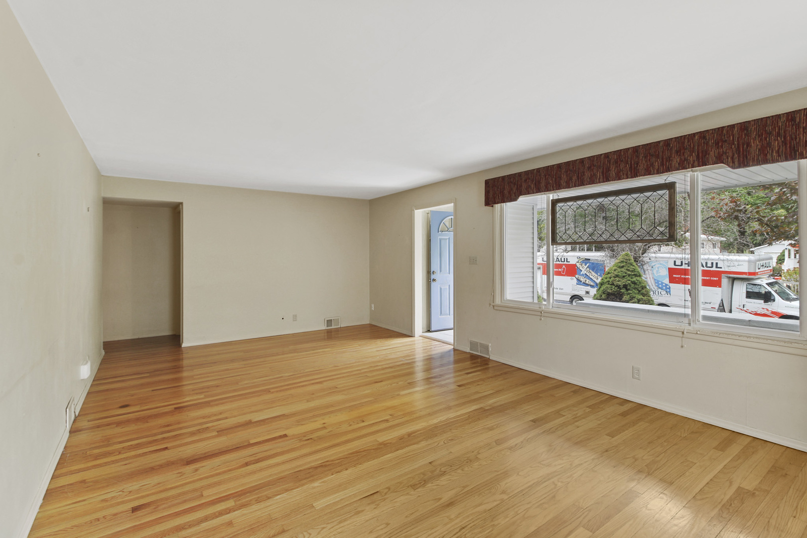 1208 West William Street Champaign, IL 61821 - Photo 4 of 30 a view of an empty room with a window and outside view