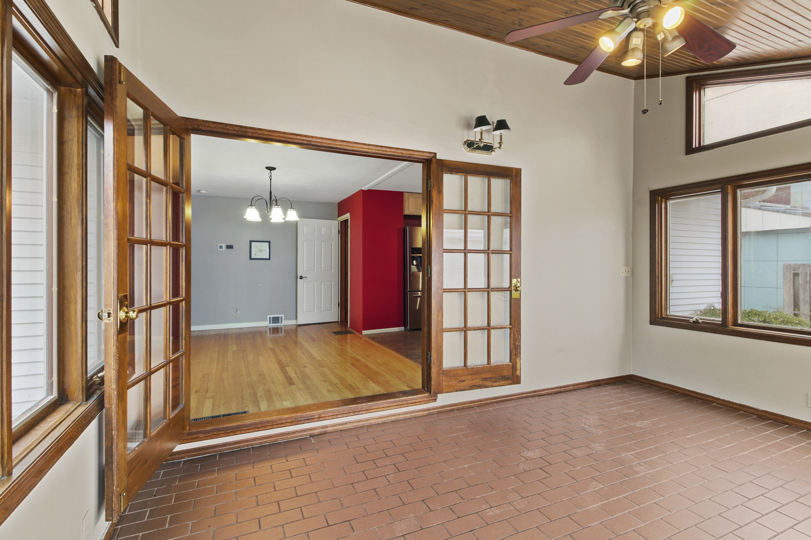 1208 West William Street Champaign, IL 61821 - Photo 8 of 30 a view of an empty room with window and chandelier