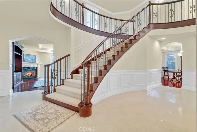 a bathroom with a sink a toilet a shower and a mirror