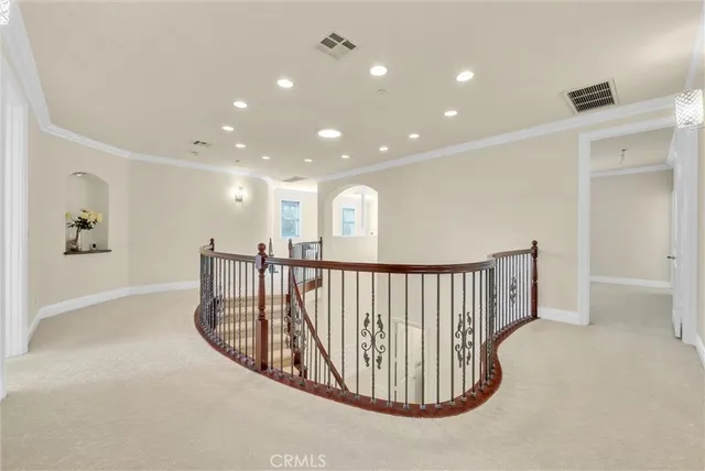 a bedroom with a bed and a desk