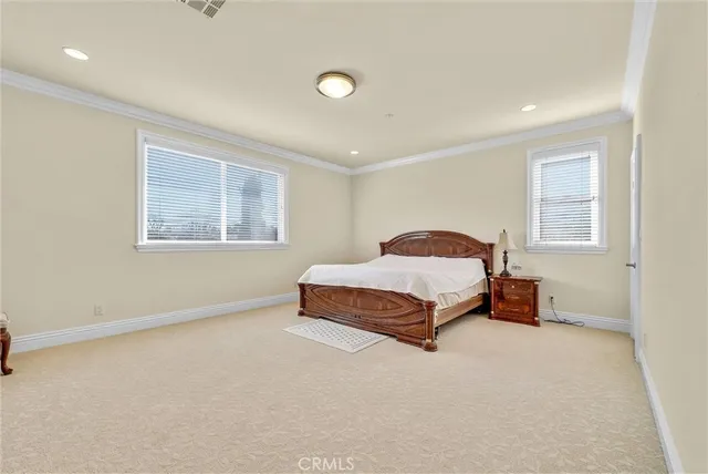 a bathroom with a granite countertop sink toilet and mirror