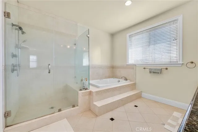 a bathroom with a bathtub and a shower