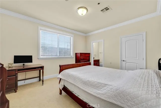 a room with a bed and gym machine