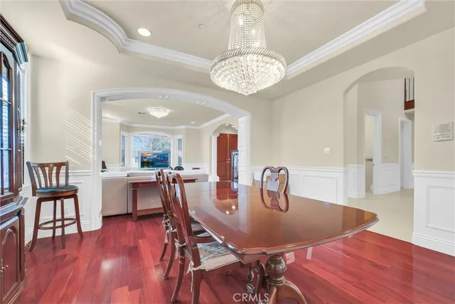 a kitchen with stainless steel appliances granite countertop wooden cabinets a sink and dishwasher