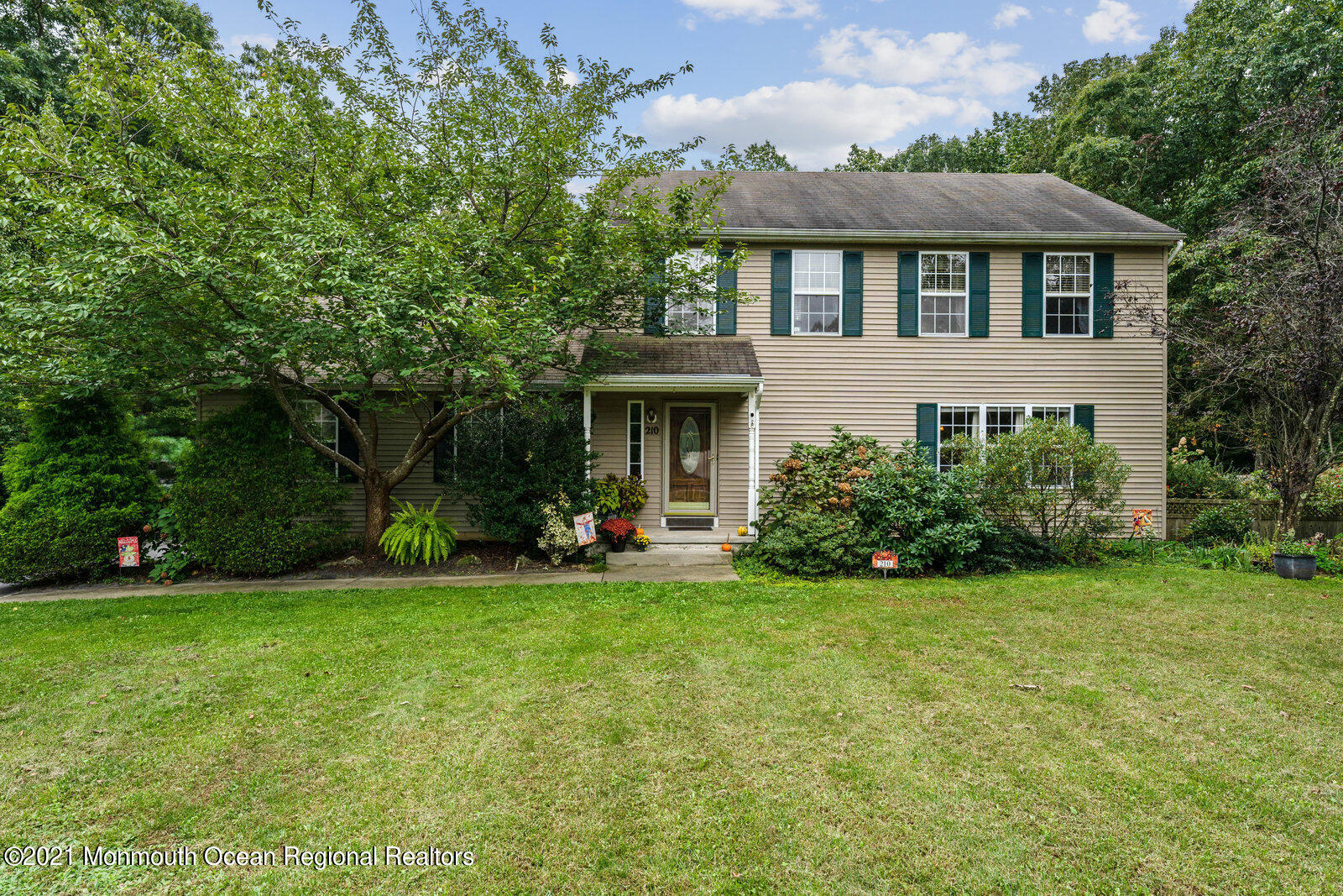 210 North Success Road Cream Ridge, NJ 08514 - Photo 3 of 50 a front view of a house with a yard and garage
