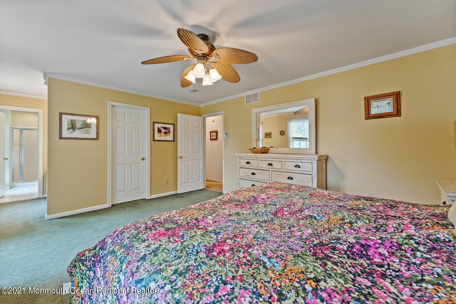 210 North Success Road Cream Ridge, NJ 08514 - Photo 25 of 50 a bedroom with a bed and a chandelier